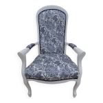 Fauteuil voltaire de style recouvert tissus fleuri en bois de qualit ettet vieilli