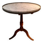 Gueridon circulaire dessu marbre blanc