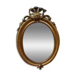 Miroir ovale en bois et stuc dor 19me