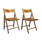 Paire de chaises pliantes vintage en bois motif étoile sur assise Paire de chaises pliantes vintage en bois motif étoile sur assise