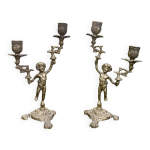 Paire de chandeliers ch�rubins en laiton