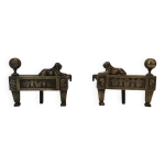 Paire de chenets d'�poque empire en bronze repr�sentant des lions allong�s