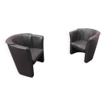 Paire de fauteuils club / salon vintage en similicuir marron - style rétro Paire de fauteuils club / salon vintage en similicuir marron - style rétro