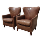 Paire de fauteuils  oreilles en cuir machalke