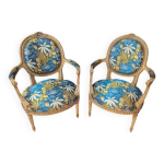 Paire de fauteuils de style louis xvi