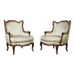 Paire de petites bergres  oreilles de style louis xv en noyer sculpt, estampille de bosson