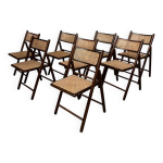 Serie de 8 chaises pliantes vintage en bois et cannage 1960