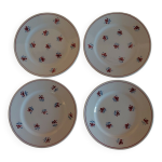 Srie de quatre assiettes  dessert en faence saint amand dcor rosettes