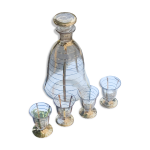 Service a liqueur compose d une carafe et de 4 petits verres à liserés dore Service a liqueur compose d une carafe et de 4 petits verres à liserés dore