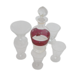 Service a liqueur compos d'une carafe et de 5 verres avec des etoiles ciseles, bouchon en forme de ...