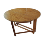 Table ovale pliable en demi lune, pieds coulissants Table ovale pliable en demi lune, pieds coulissants