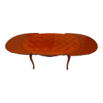 Table ovale avec rallonges sous le plateau
