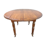 Table ronde 4 pieds en merisier avec 2 allonges
