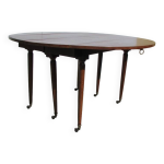 Table ronde 6 pieds fuseaux en acajou, extensible Table ronde 6 pieds fuseaux en acajou, extensible