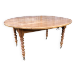 Table ronde en cerisier massif extensible aux pieds torsad�, louis philippe.