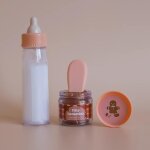Coffret repas petit pot et biberon magiques pour poup�e pain d'�pices