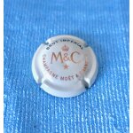 Capsule champagne moët et chandon. brut impérial m&c lettres noires et or sur fond crème Capsule champagne moët et chandon. brut impérial m&c lettres noires et or sur fond crème