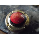 Capsule de champagne piper hiedsieck rouge et or Capsule de champagne piper hiedsieck rouge et or