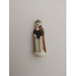 Fève santon homme chapeau avec une canne tunique blanche et cape marron Fève santon homme chapeau avec une canne tunique blanche et cape marron
