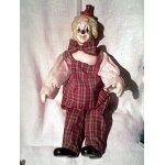 Joli clown habill� - porcelaine - assis sur presentoir / 28 cm