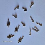 Lot de 14 breloques, m�dailles en m�tal , neufs, saxo, trombone, violon