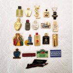 Lot 20 pin's parfum dont ysl, caron, givenchy et autres