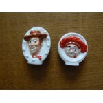 Toy story disney / pixar. lot de 2 f�ves en c�ramique : woody et jessie
