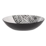 Assiette creuse en porcelaine blanche et noire à motifs Assiette creuse en porcelaine blanche et noire à motifs