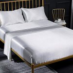 Ensemble de draps en satin quatre pi�ces couleur unie�: 1 drap - housse � poches profondes 1 drap plat ...