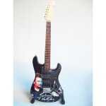 Guitare miniature stratocaster noire en hommage  johnny hallyday