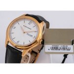 Montre homme emporio armani swiss made avec jour et date bracelet cuir et cadran or rose. ars8601