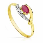 Bague en or bicolore 18 carats avec rubis de 5 mm et zircon cubique.