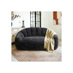 Canap� sculptural aux courbes �l�gantes avec dossier ondul� con�u pour sublimer les espaces de vie contemporai ...