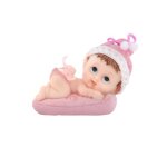 Figurine petite fille sur un coussin 9 cm - rose