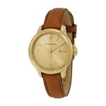 Montre femme burberry bu10101 made suisse plaque or avec date.