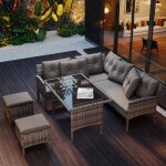 Salon de jardin 7 places en r�sine tress�e avec canap� d?angle table basse en verre poufs et coussins ...