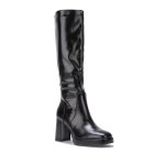 Bottes en simili verni dotes dun talon carr et dune plateforme. fermeture par un zip ct intrieur. ...