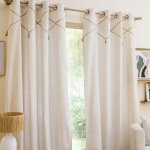 Lot de 2 rideaux à ?illets lacia - 140 x 240 cm - polycoton uni avec détails en jute et pompons Lot de 2 rideaux à ?illets lacia - 140 x 240 cm - polycoton uni avec détails en jute et pompons