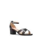 Sandales � talon en simili. dot�es de deux brides crois�es devant. bride � boucle ajustable autour de ...