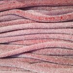 Rglisses amricains cerise acidule - luna - park 67 cm carton de 100 pices