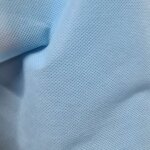 Intiss spun dperlant et rsistant aspect tissu uni bleu ciel 160cm - mondial tissus