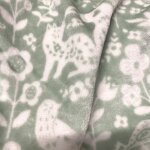 Maille doudou imprim�e animaux fleuris vert - domotex - mondial tissus