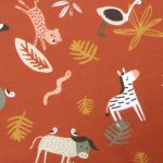 Tissu cretonne de coton terracotta  motifs animaux savane - mondial tissus