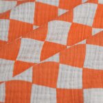 Tissu double gaze damier craie orange - mondial tissus