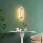 Applique murale ovale dor�e led avec abat - jour en alb�tre - calizia