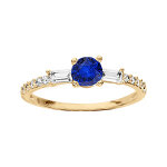 Bague en plaqu� or style alliance rail oxyde bleu central et oxydes blancs sertis