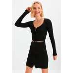 Gilet court et jupe droite taille haute noir