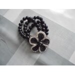 Bracelet artisanal perles noires grosse fleur strass