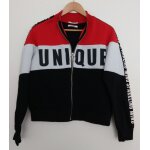 Gilet multicolore a zip. rouge blanc et noir. inscription unique. jennyfer. polyester. coton. taille ...