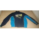 Haut survetement puma taille 8 ans .